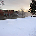 winooski river and historic mill buildings in winter